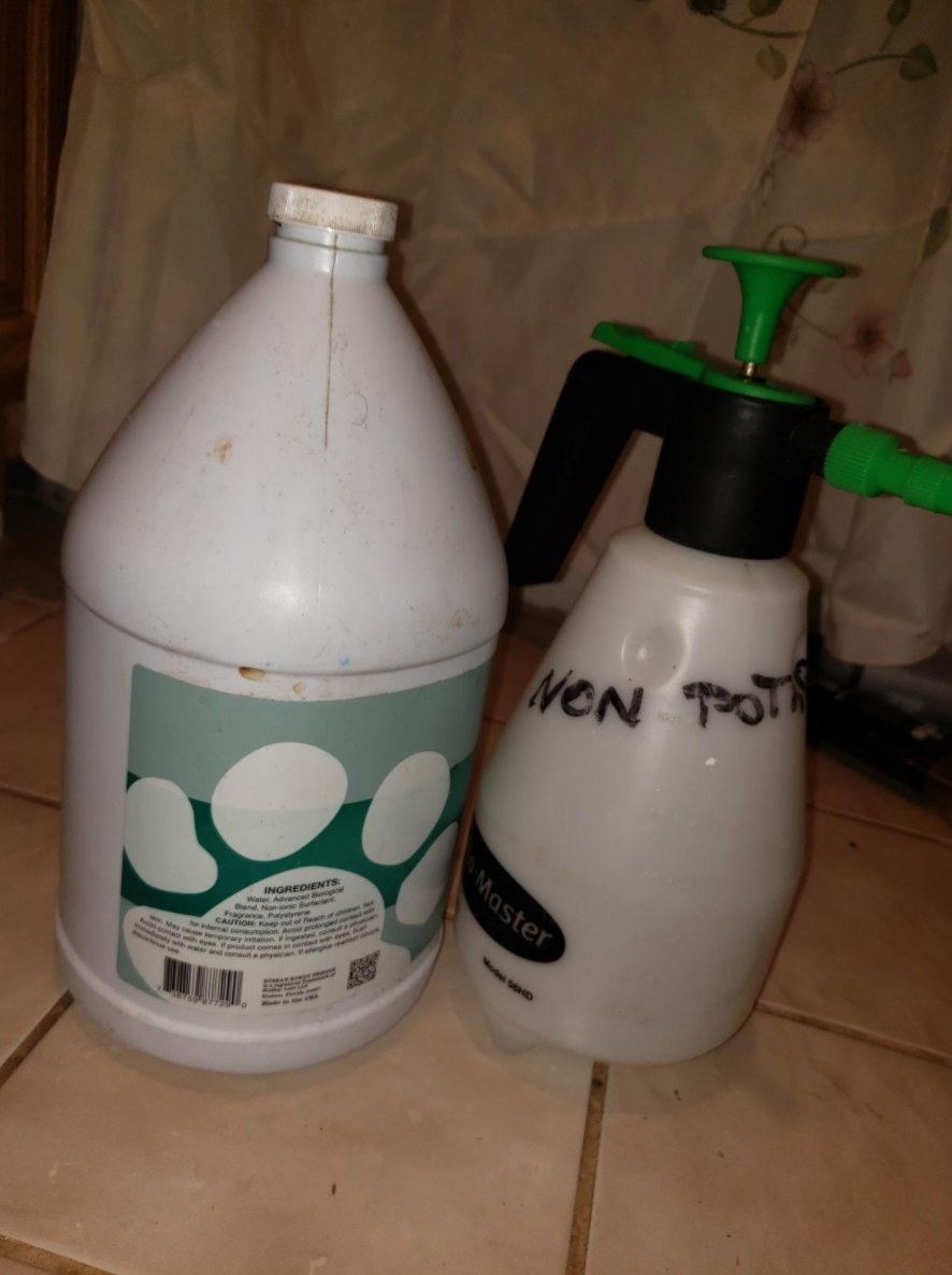 A reviewer&#x27;s image of the white bottle of commercial cleaner