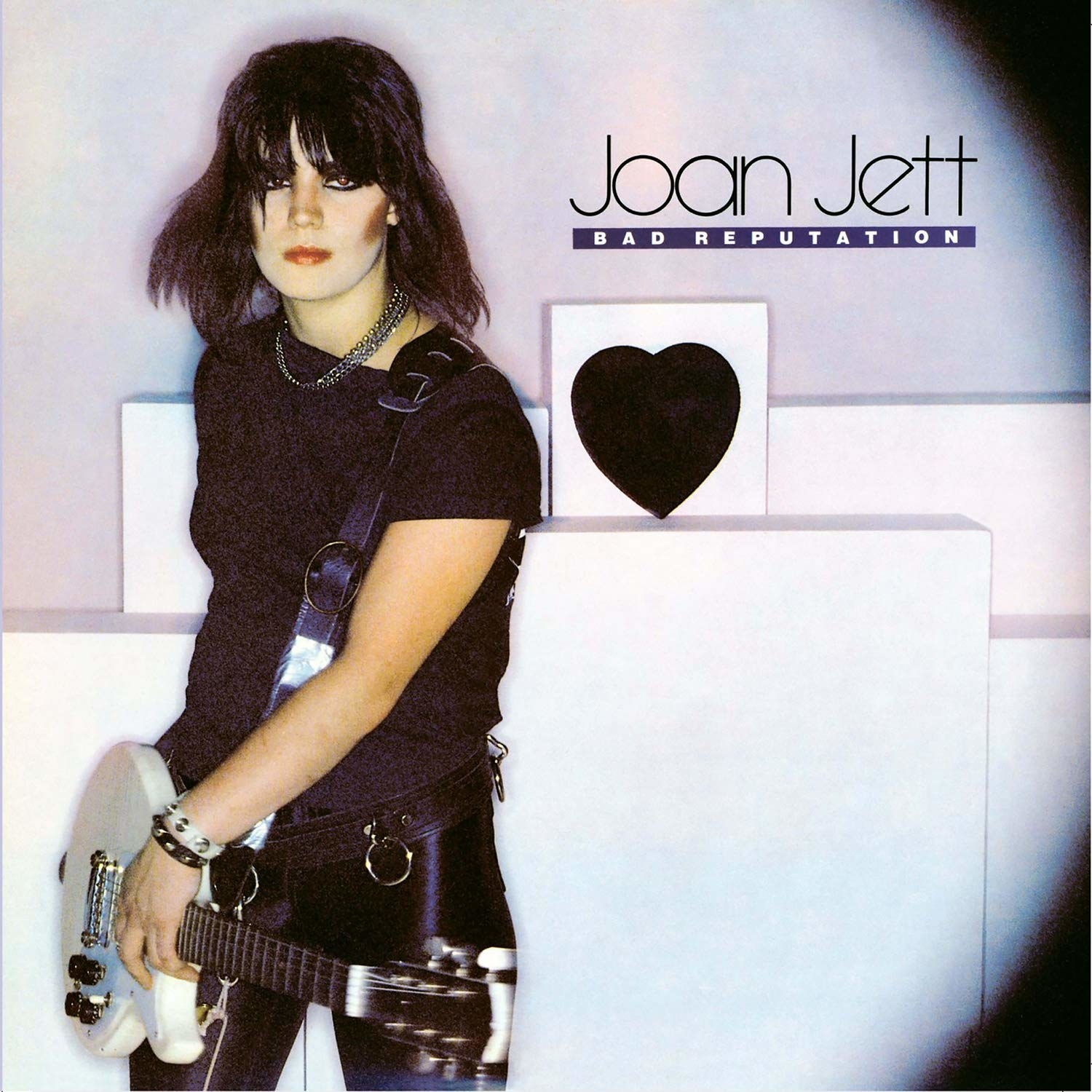 album cover of Bad Reputation showing Joan Jett standing with her guitar