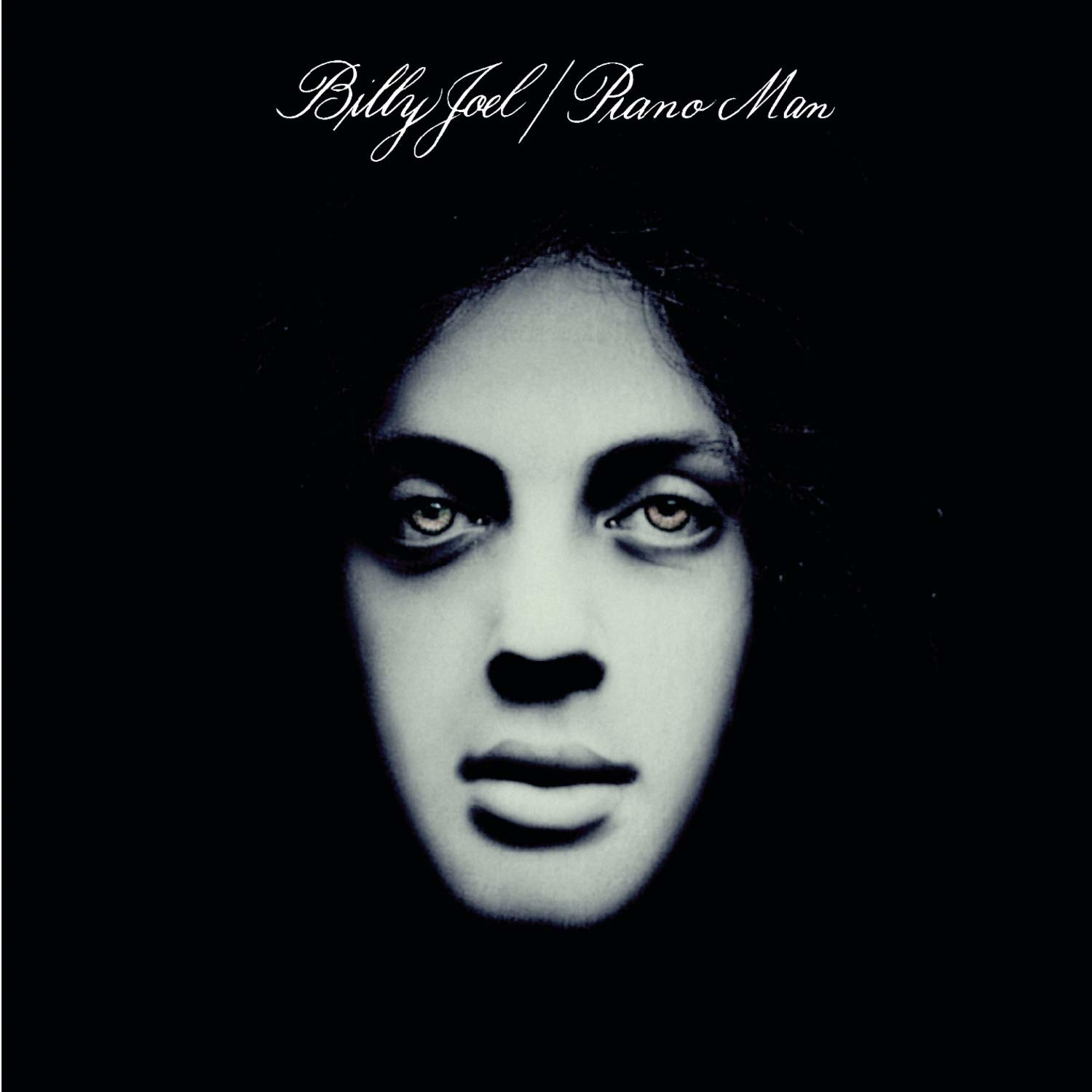 album cover of Piano Man showing Billy Joel&#x27;s face coming out of darkness