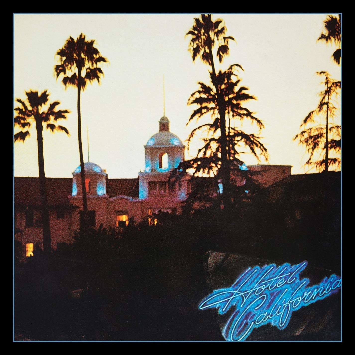 album cover of Hotel California showing a hotel with palm trees in the distance