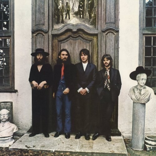 album cover of Hey Jude showing the Beatles standing in front of the closed door