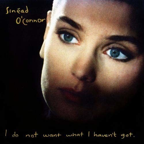 album cover of I Do Not Want What I Haven&#x27;t Got showing Sinead O&#x27;Connor&#x27;s face with only her eyes lit