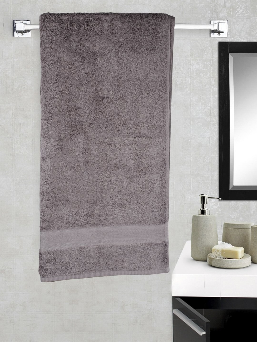 A grey towel on a wall 