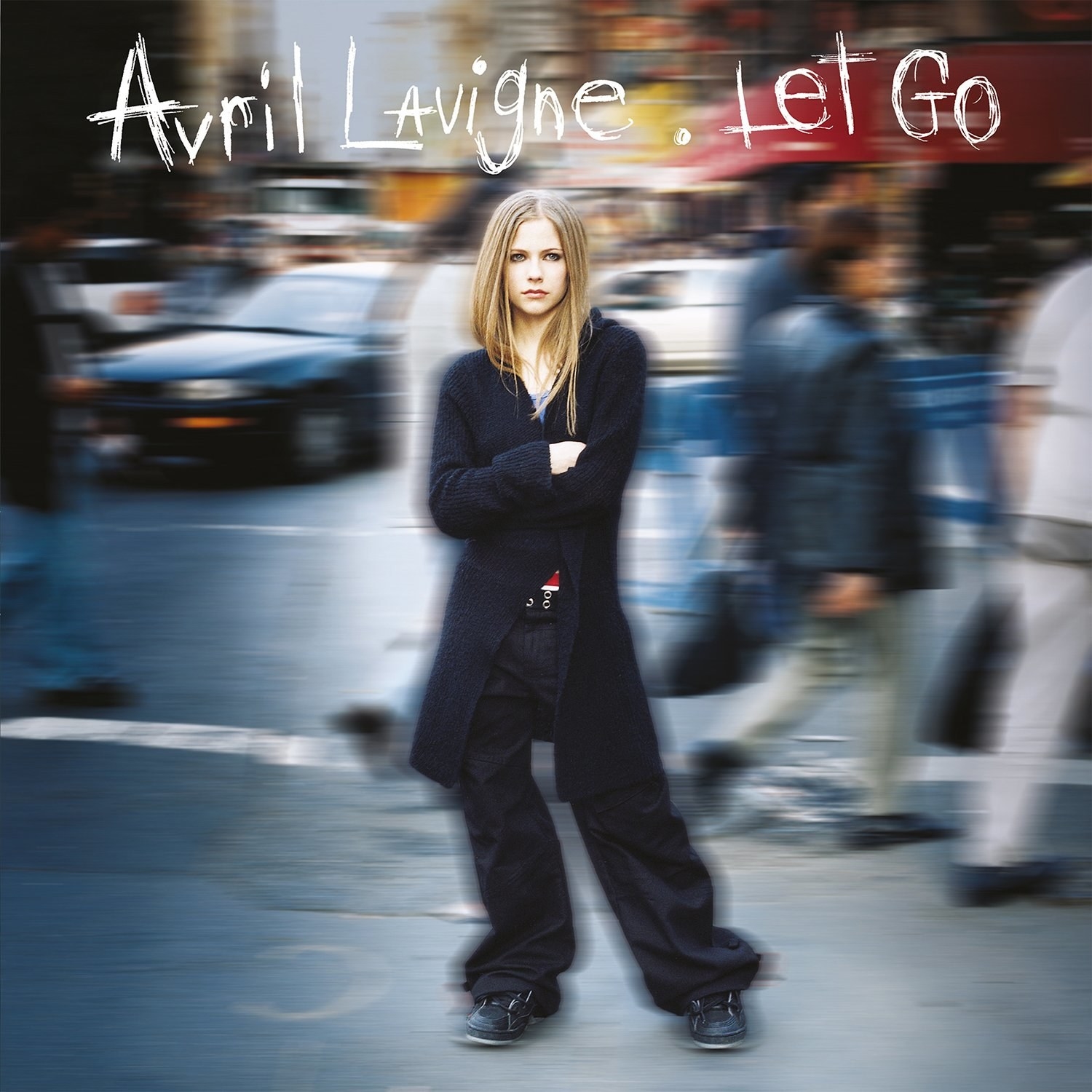 album cover of Let Go with Avril Lavigne standing in all black with her arms crossed as the blurred background depicts a busy street