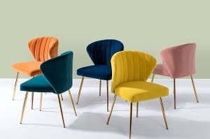 an array of colorful velvet chairs