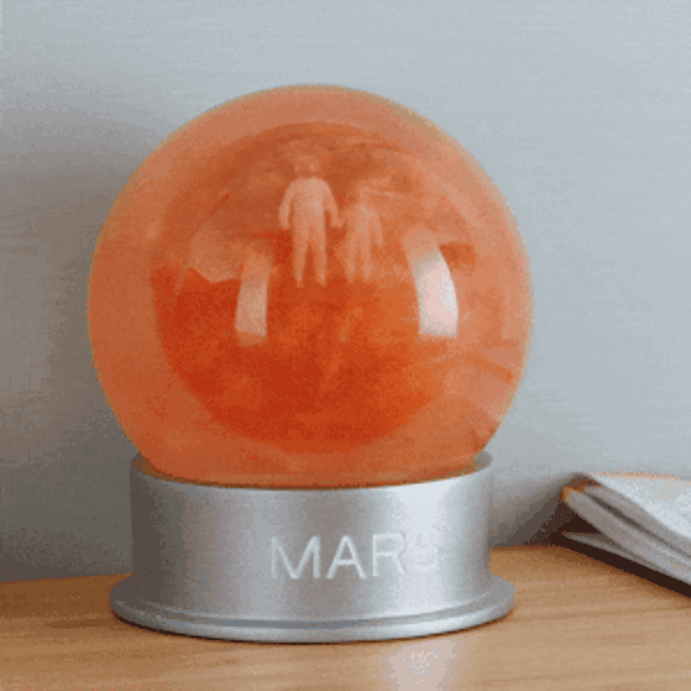 gif of the mars dust globe with two astronaut figures in it