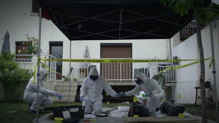 Investigators search the backyard of the Nantes home of a French count.