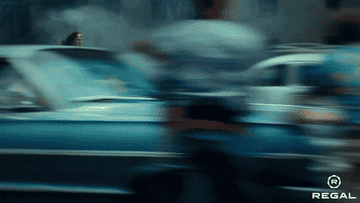 Wonder Woman running fast through a busy street