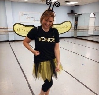 A woman dressed as a bee with &quot;yoncé&quot; her shirt