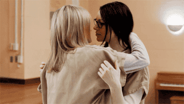 Piper and Alex hugging and kissing