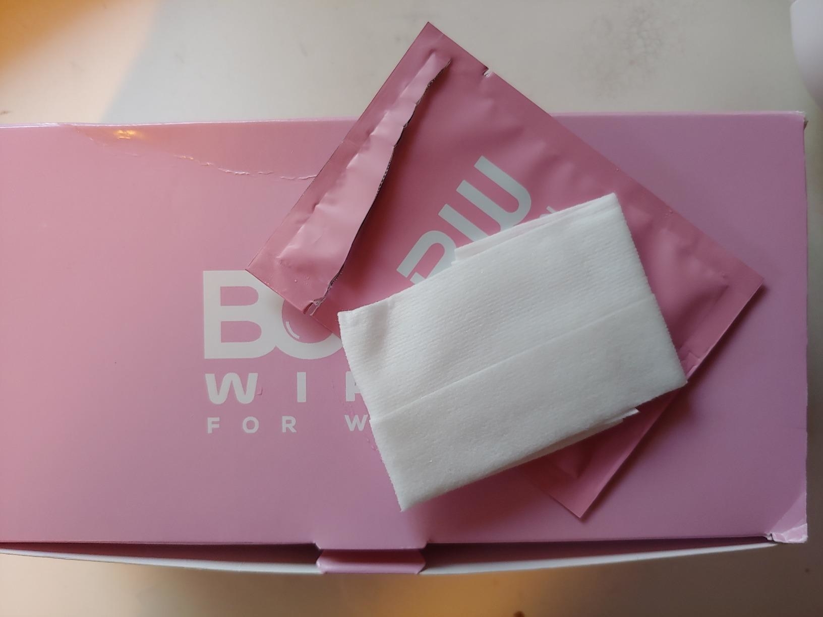 An open individually wrapped booty wipe