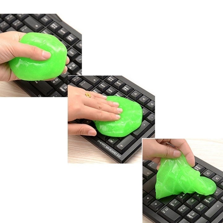A person cleaning a keyboard with bright green cleaning slime.