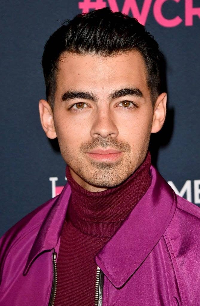 Joe wearing a turtleneck and jacket