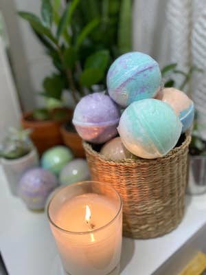 A reviewer's basket with the colorful bath bombs inside
