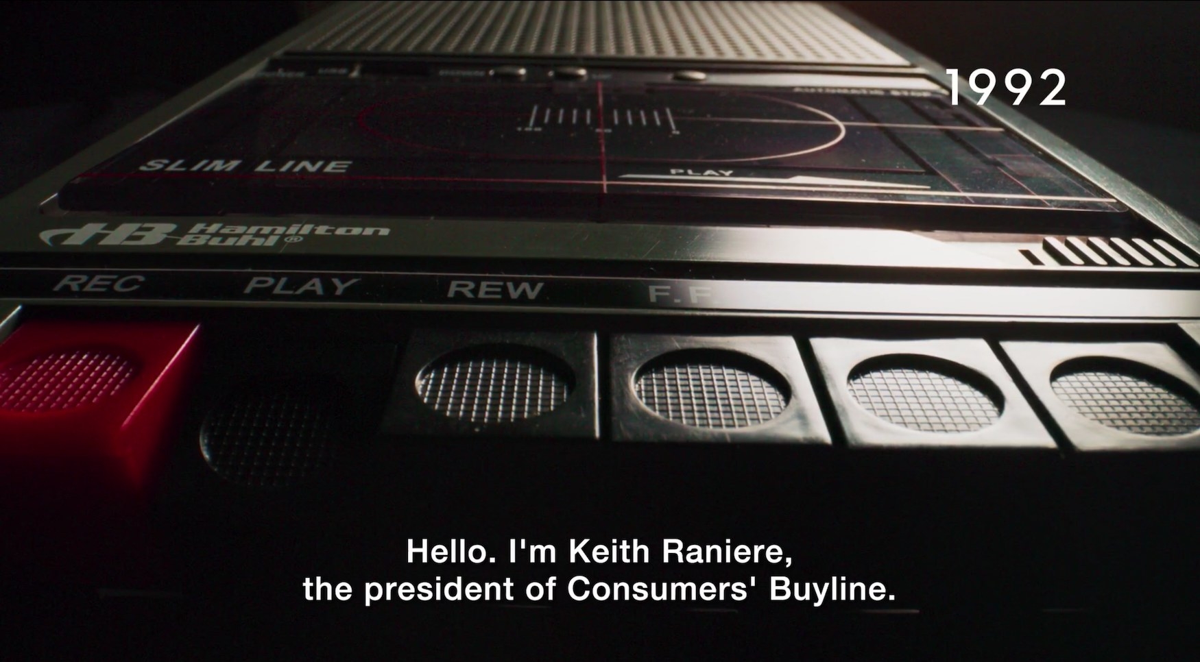 A tape recorder with the caption text &quot;Hello, I&#x27;m Keith Raniere, the president of Consumers&#x27; Buyline&quot;