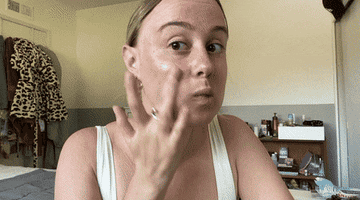 A gif of one of the testers applying the foundation.