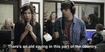 A gif from Portlandia of Carrie and Fred standing in an office holding recording equipment and saying there&#x27;s an old saying in this part of the country it goes like this I can&#x27;t read