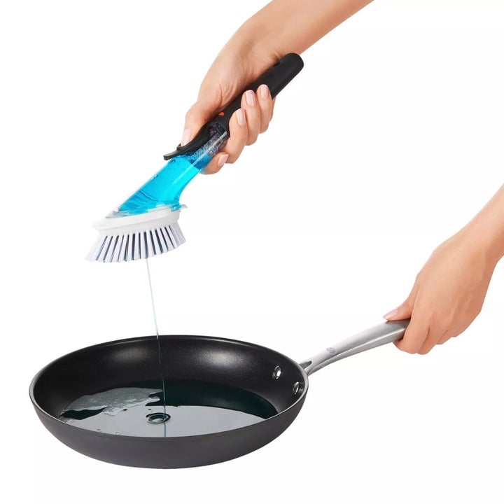 The dish brush dispensing soap