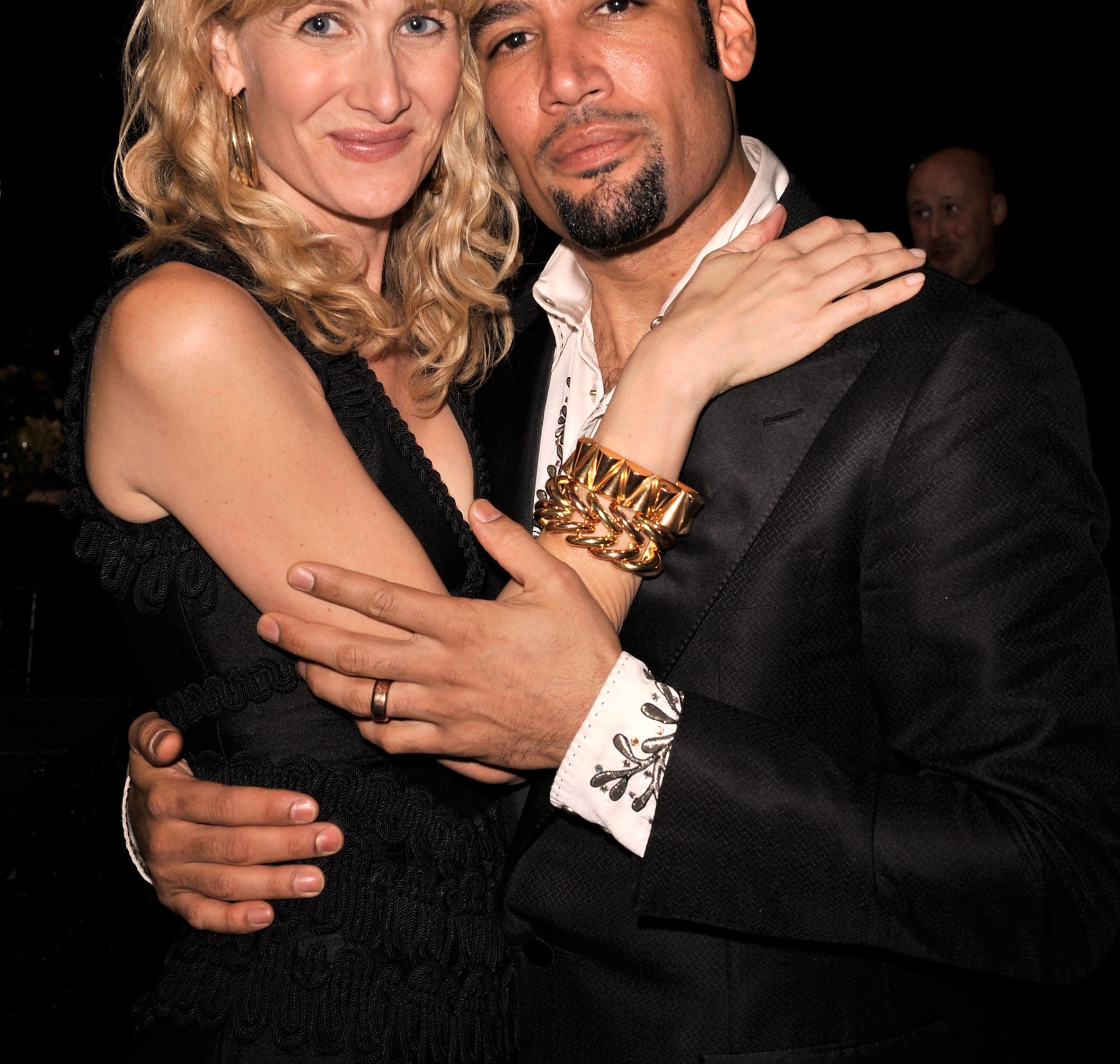 A photo of Laura Dern and Ben Harper hugging at an event