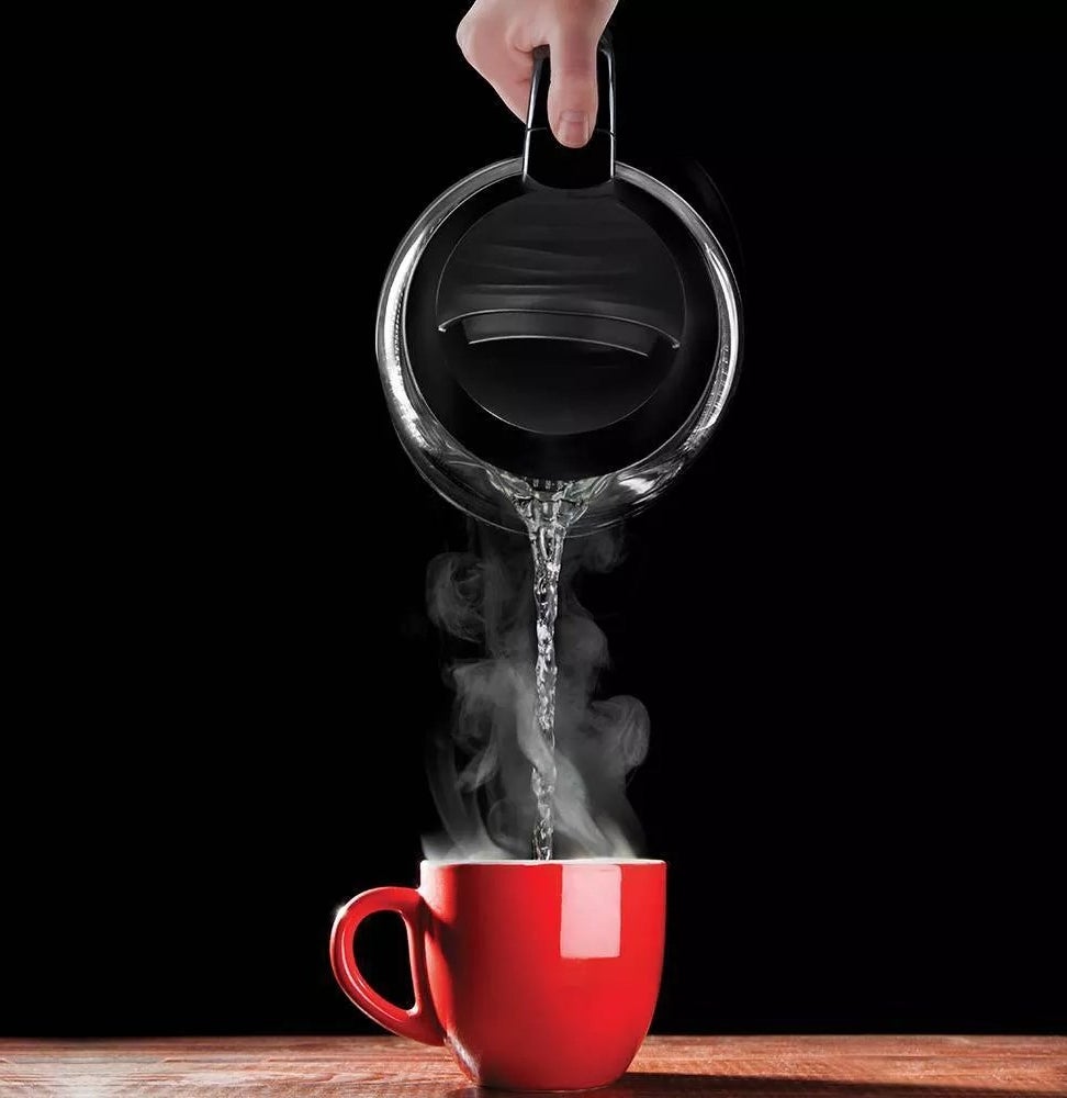 The electric kettle pouring a cup of tea