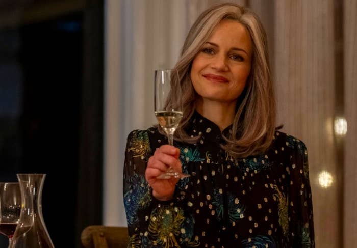 The Haunting of Bly Manor still: An older Jamie raises her glass to toast at the wedding