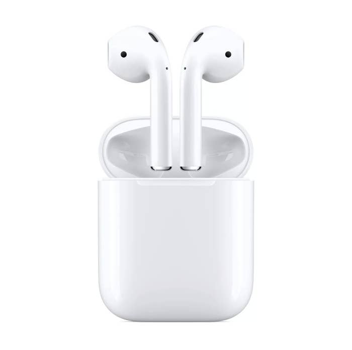 White Apple AirPods coming out of the charging case