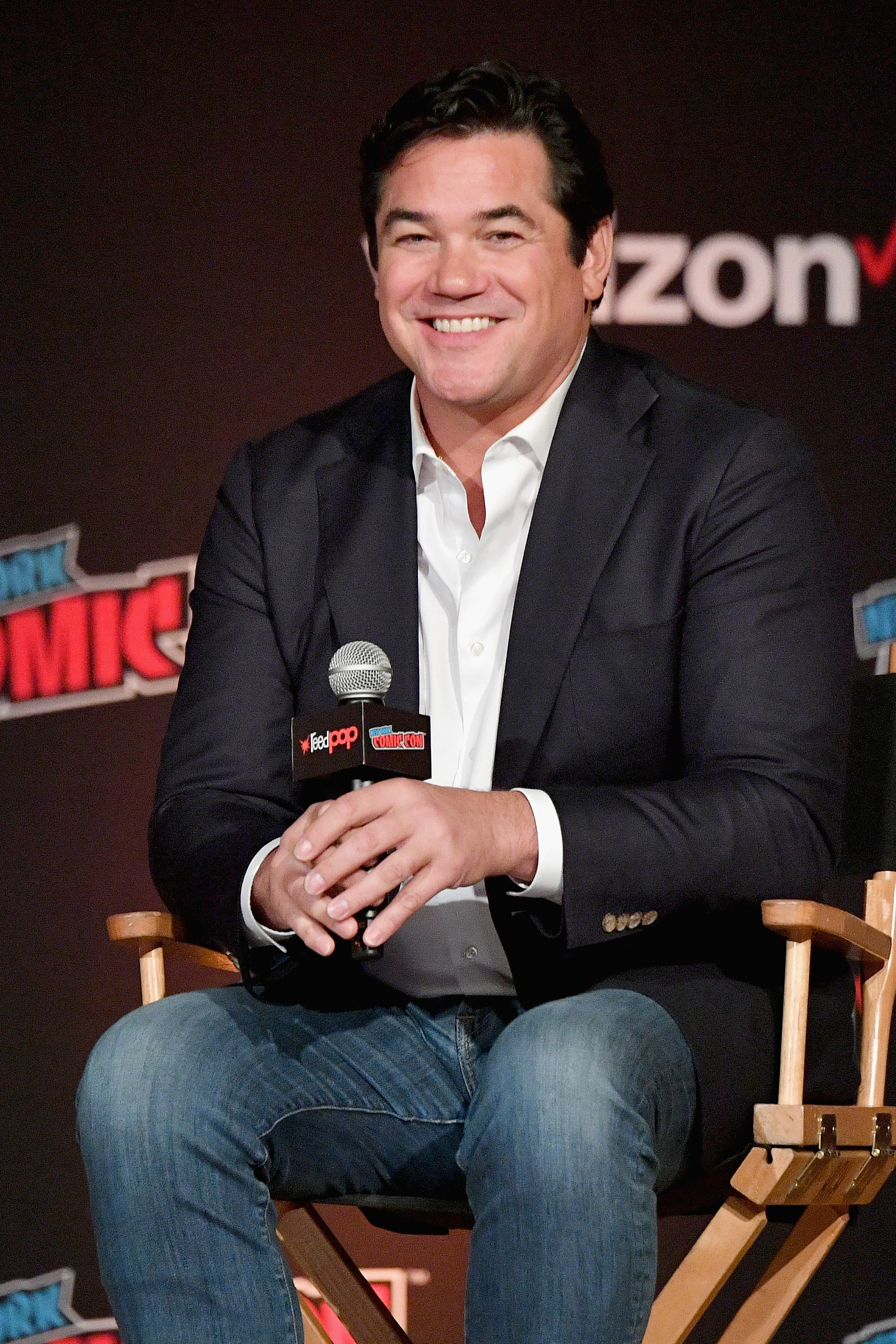 Dean sitting and taking questions at an event