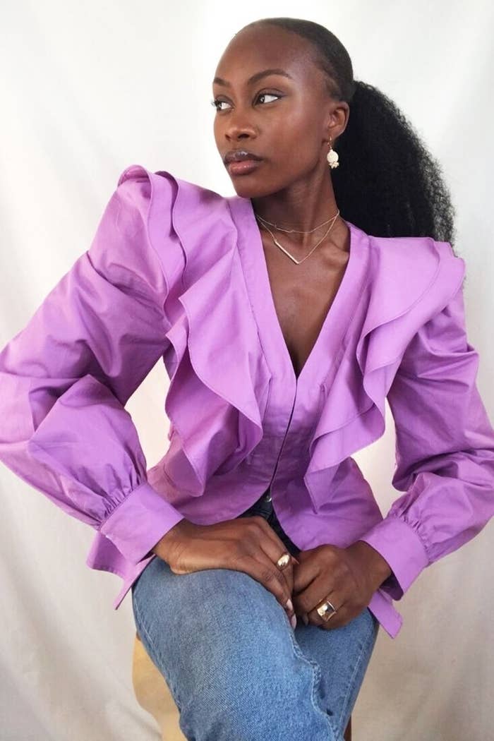 model wearing lilac sleeved shirt