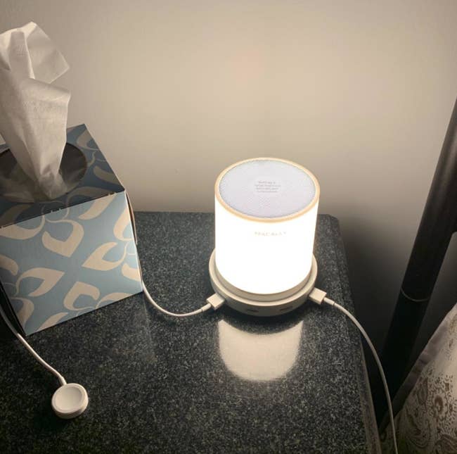 A reviewer's lamp with two cords attached