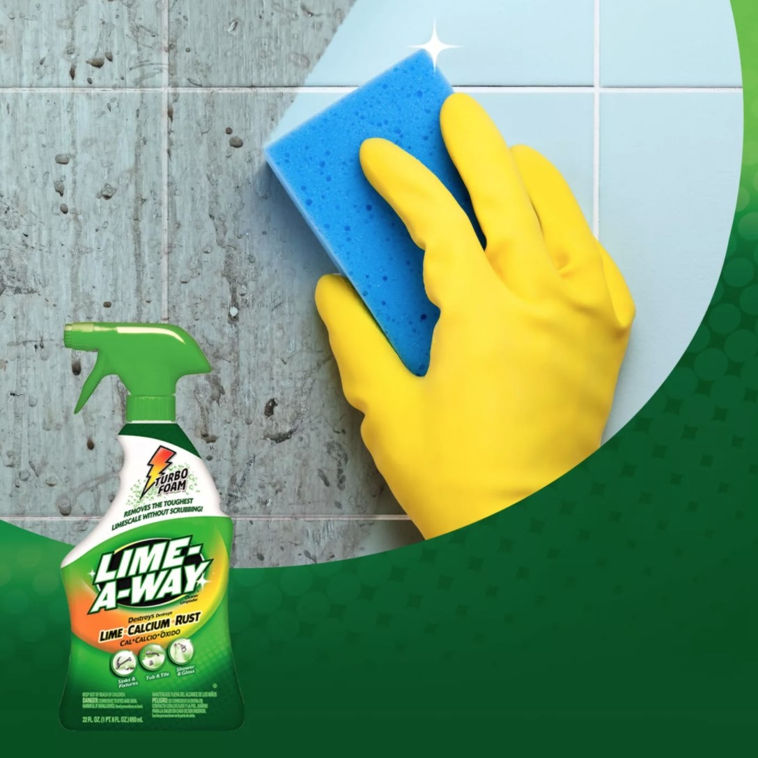 A dirty wall being cleaned with a blue sponge