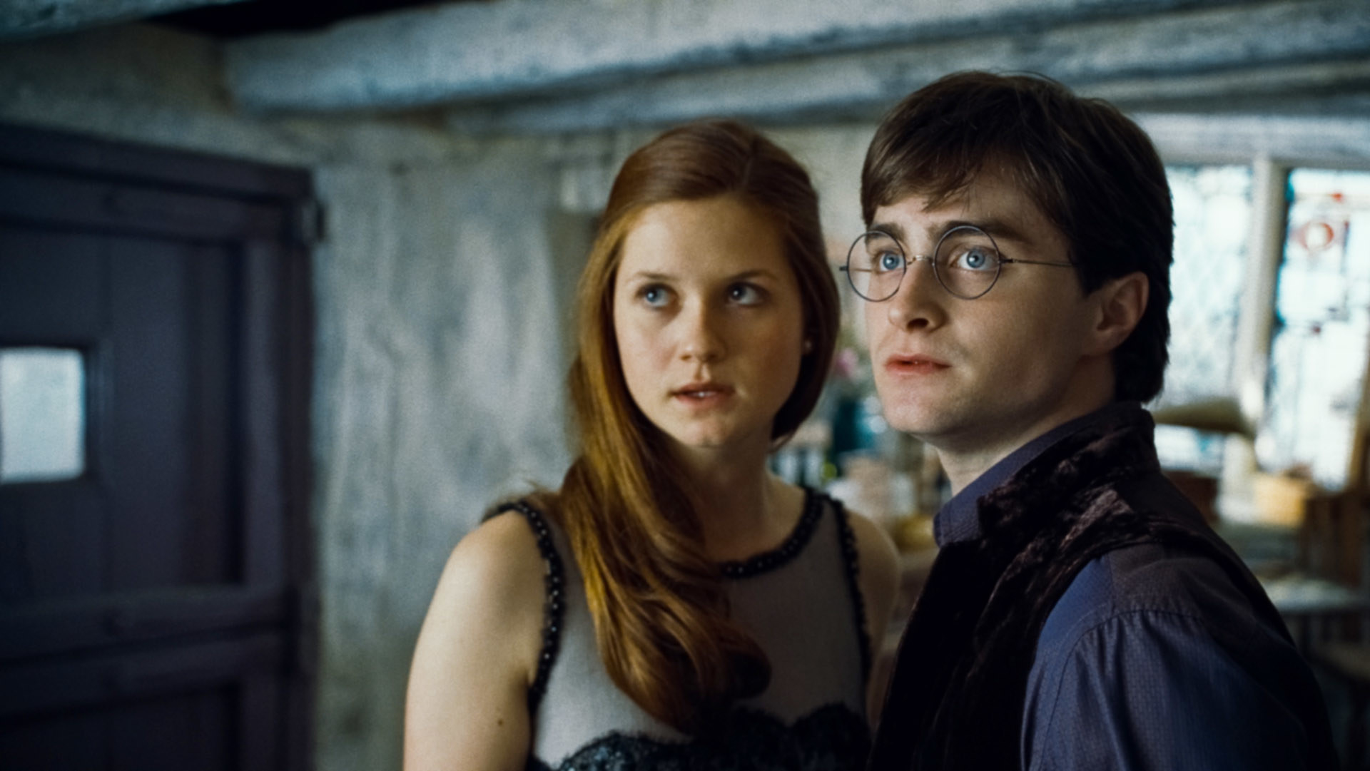 Ginny and Harry standing together