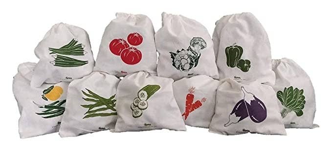 Cloth bags with pictures of vegetables printed on them.