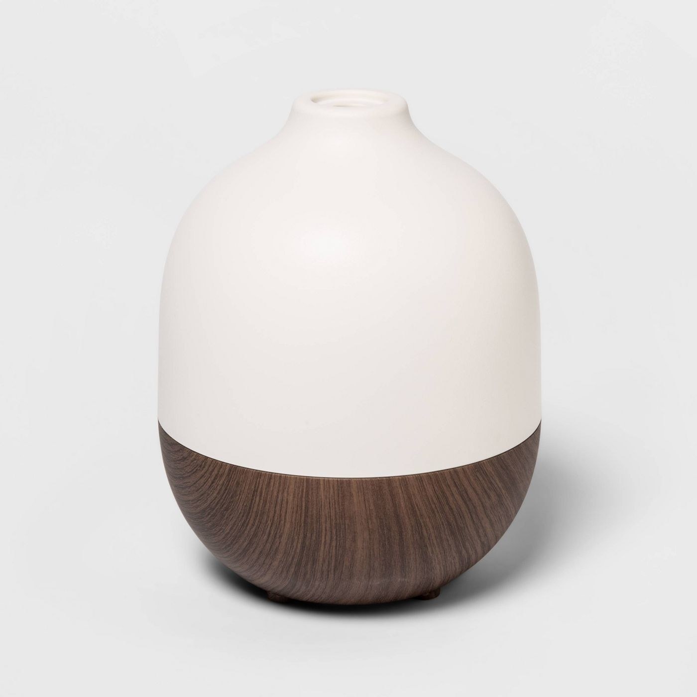 oil diffuser with a wooden bottom and white top