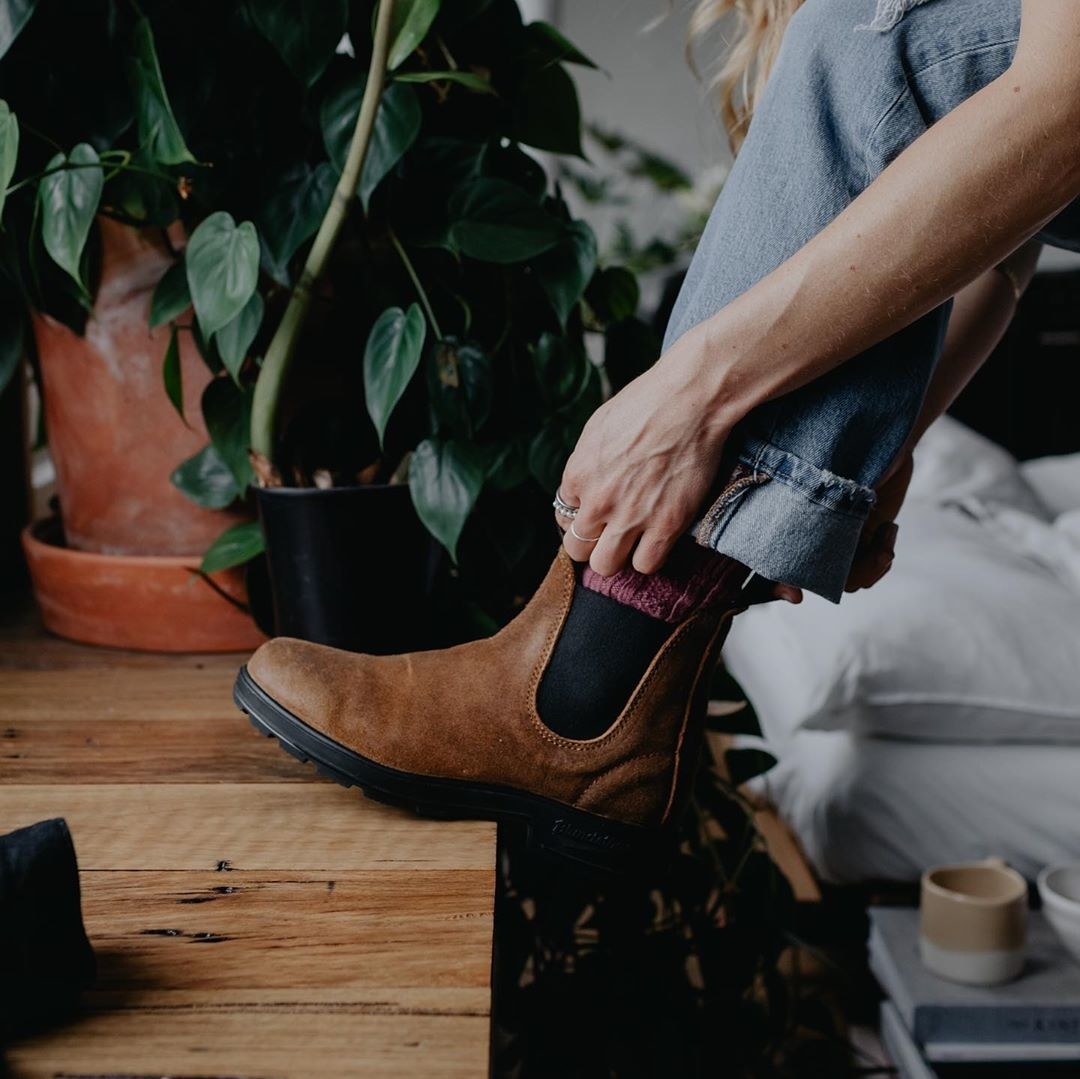 model wearing the brown and black boots