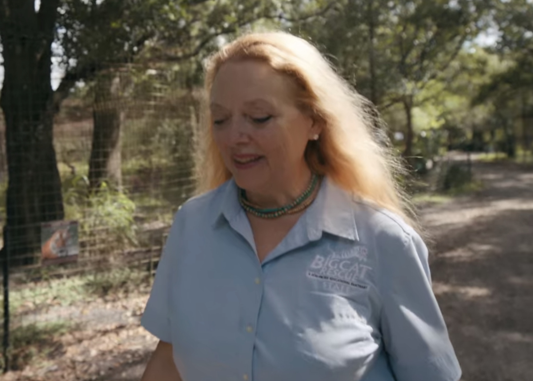 Carole looking down with the wind in her hair