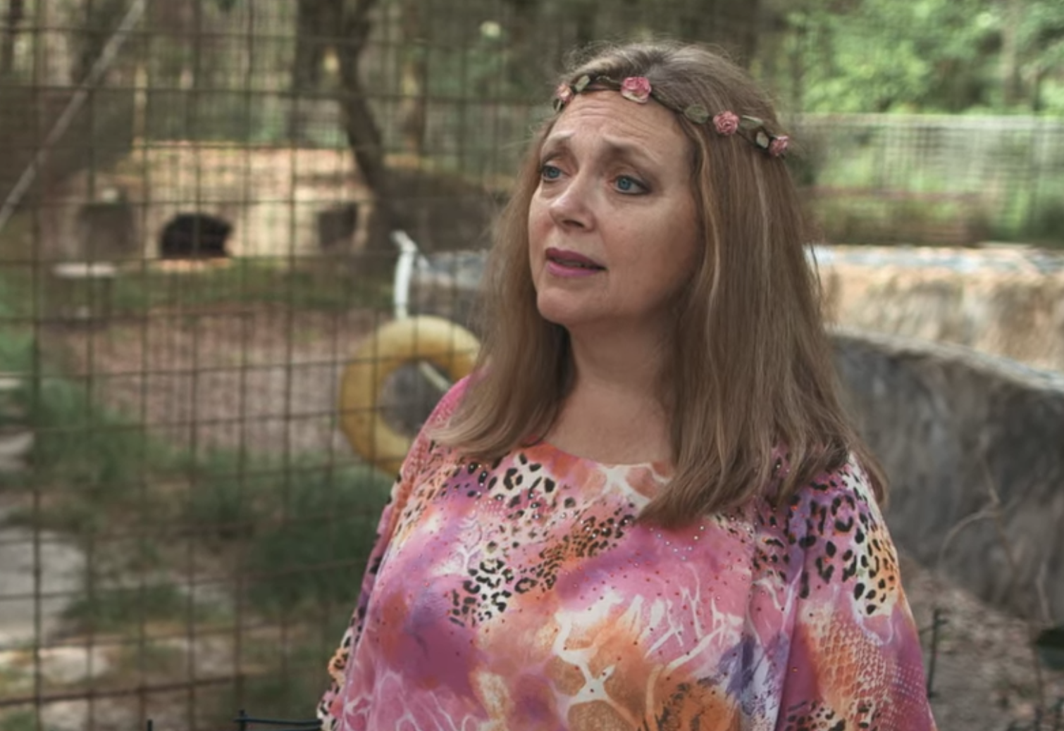 Carole in a flower crown and animal print top