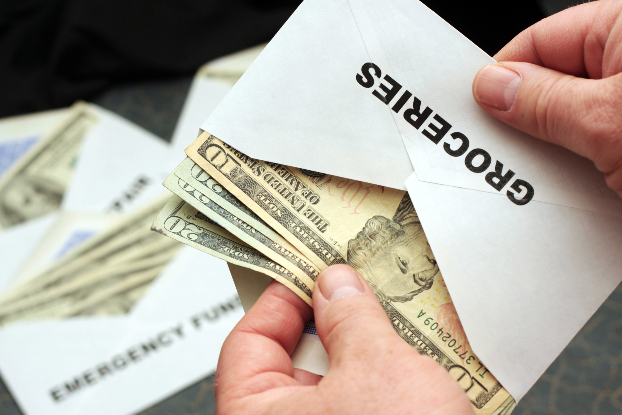 An envelope labeled &quot;groceries&quot; with cash inside