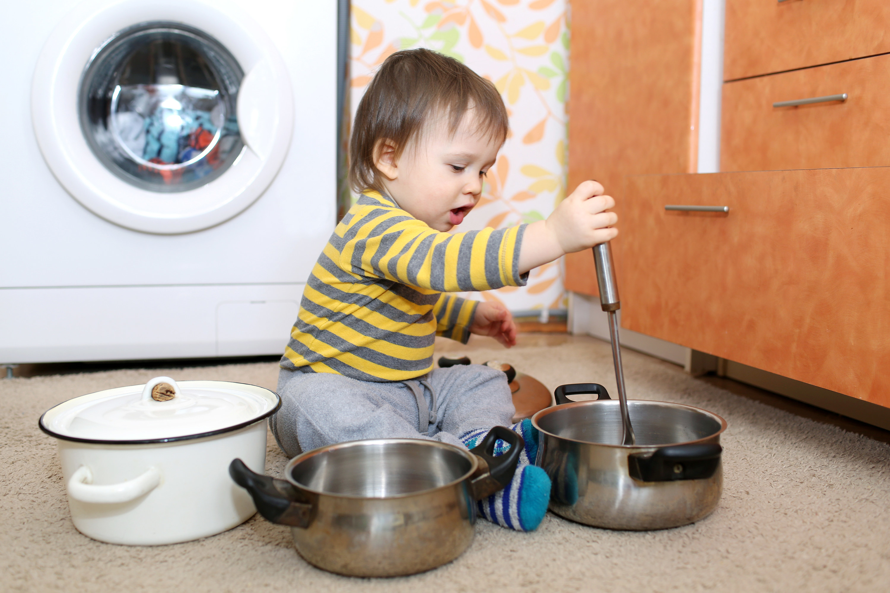 Baby playing with pots and pans