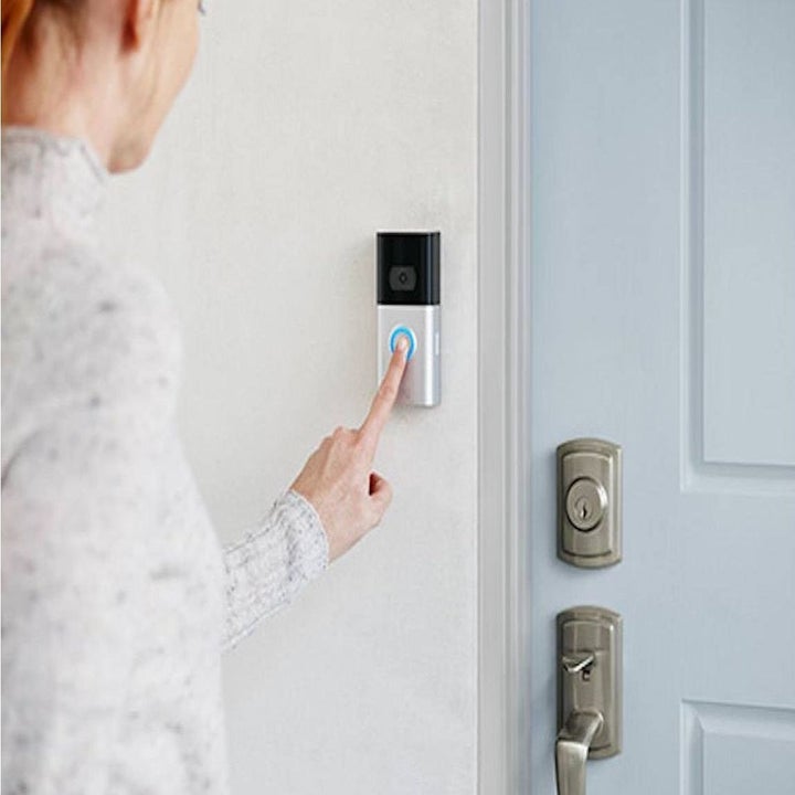 person ringing a ring video doorbell