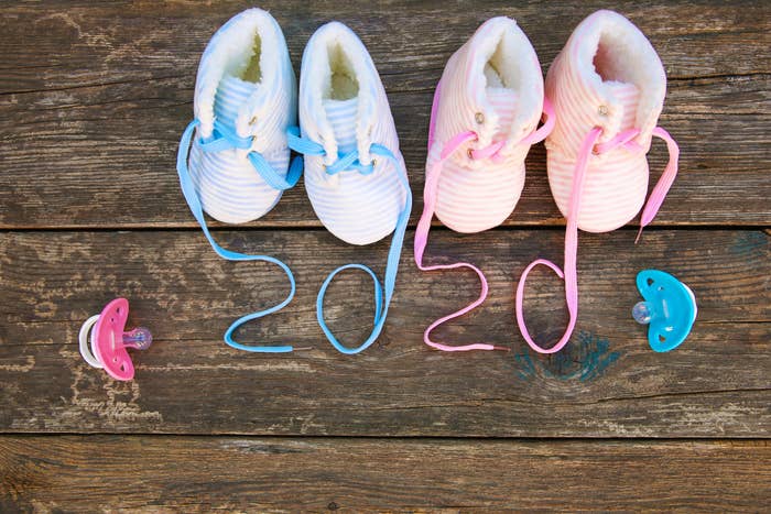 Baby booties with show laces that spell out 2020