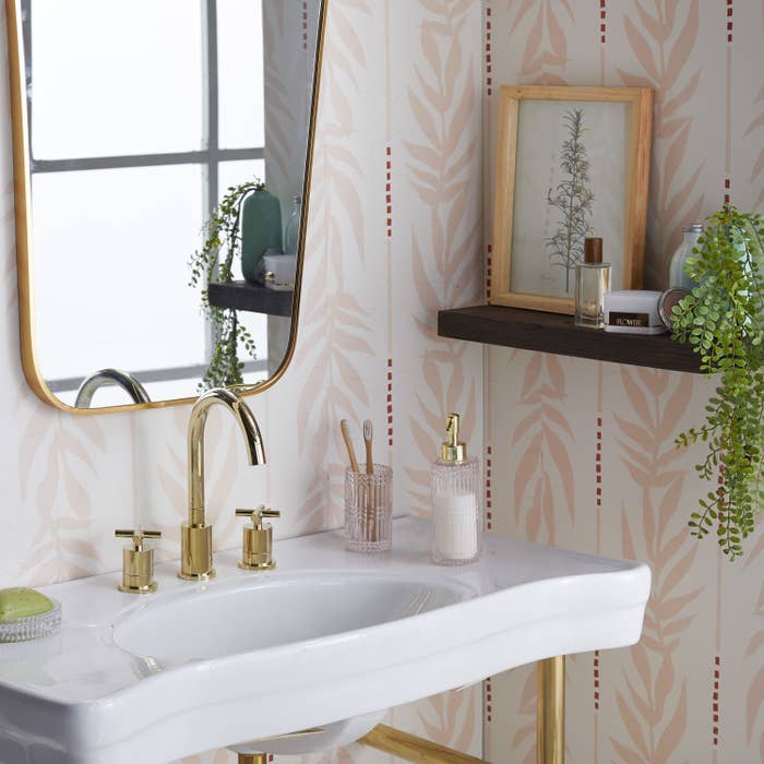 The wallpaper featured in a stylish bathroom