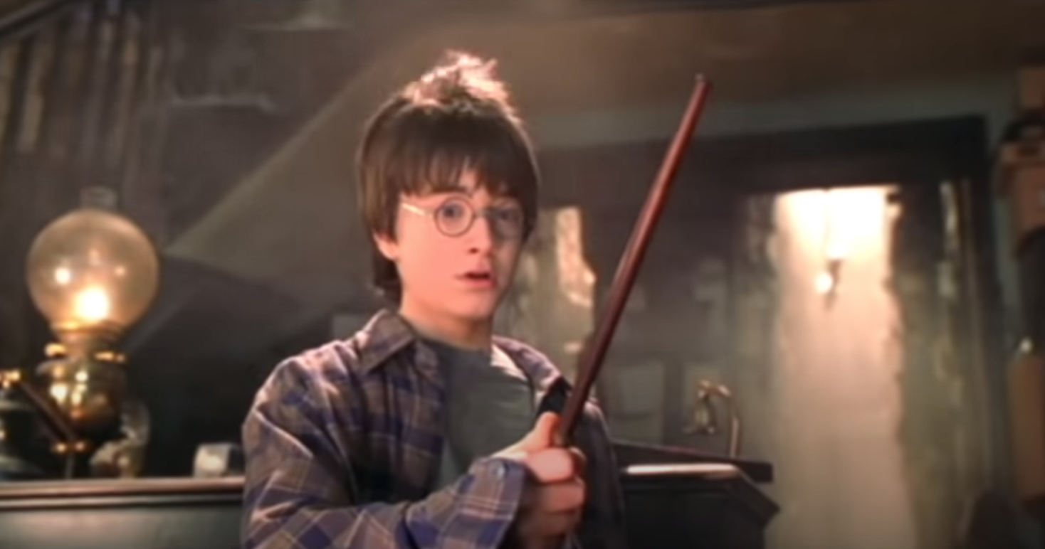 Harry Potter tries out his magic wand for the first time in Ollivander&#x27;s