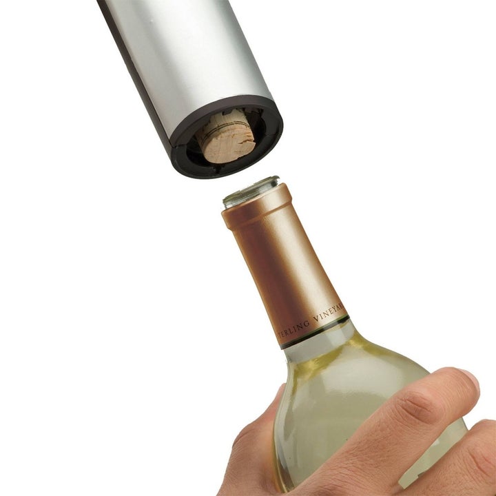 electric wine bottle opener with a cork in it