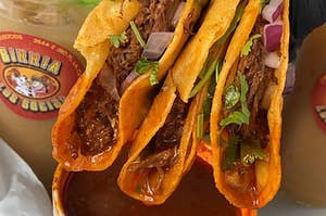 three tacos dips in soup