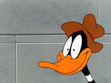 Daffy Duck from &quot;Looney Tunes&quot; with eyeballs turning into dollar signs