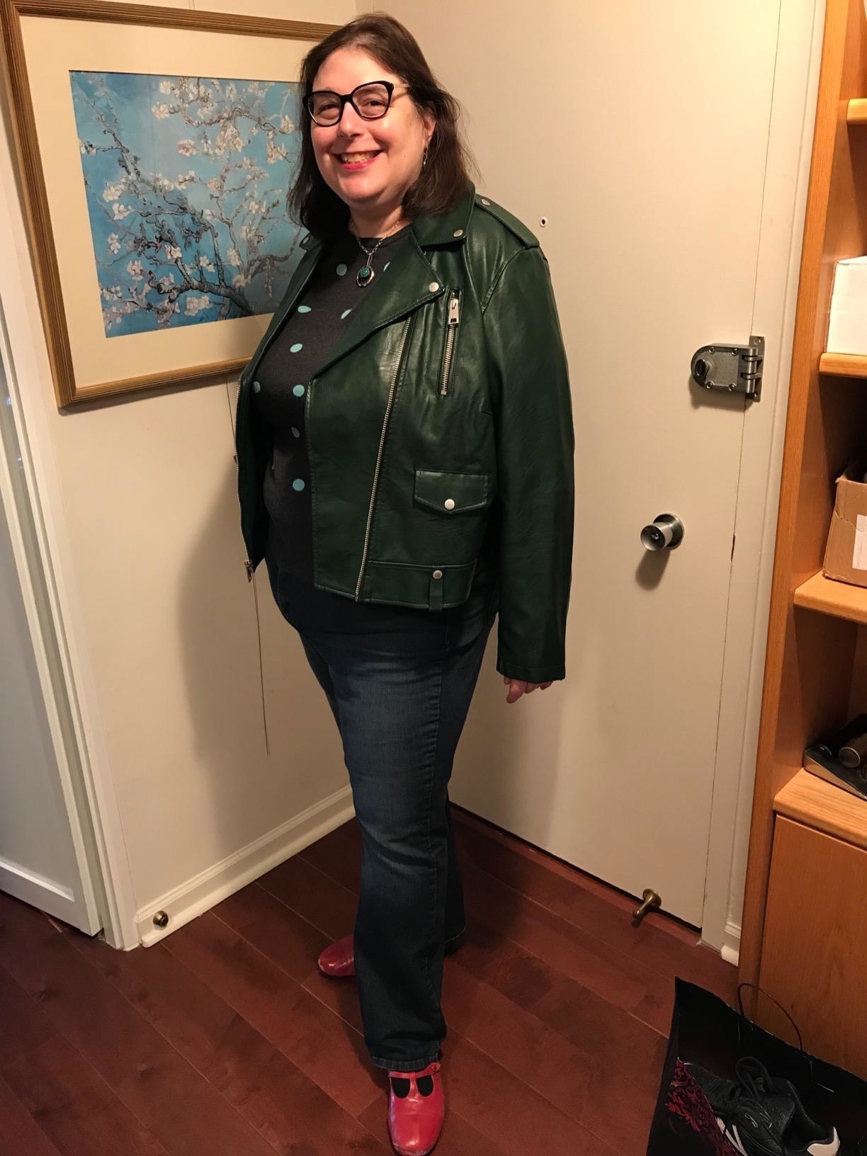 Reviewer wearing the jacket in dark green