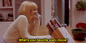 A girl with short hair and bangs is on the phone. She says, what&#x27;s your favorite scary movie?