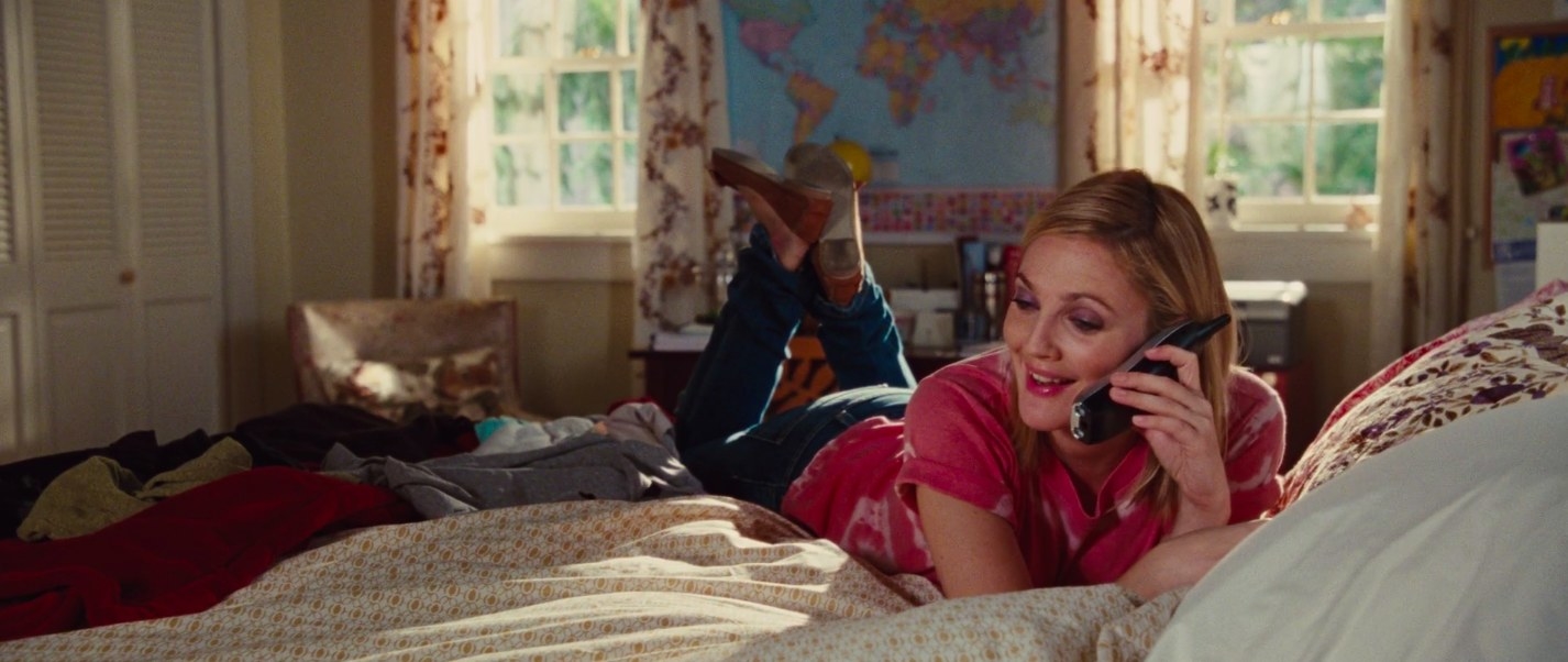 Drew Barrymore talking on the phone while lying on the bed in &quot;Going the Distance&quot;