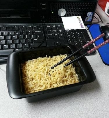 A reviewer&#x27;s cooked ramen in the black rectangular bowl