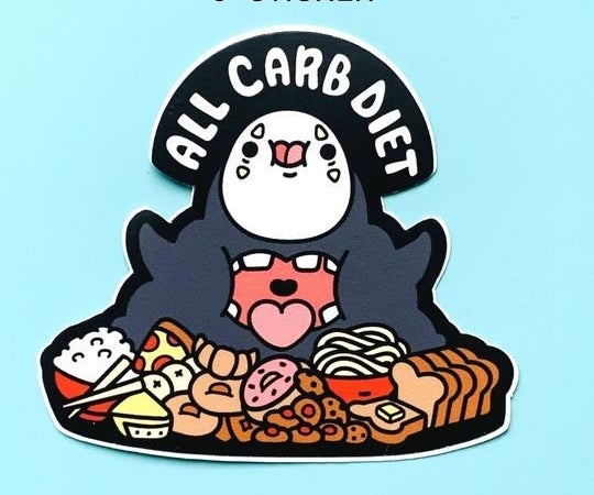 A cutesy version of No Face from &quot;Spirited Away&quot; with his mouth open and surrounded by food like pizza, bread, donuts, and rice with the text &quot;All carb diet&quot;